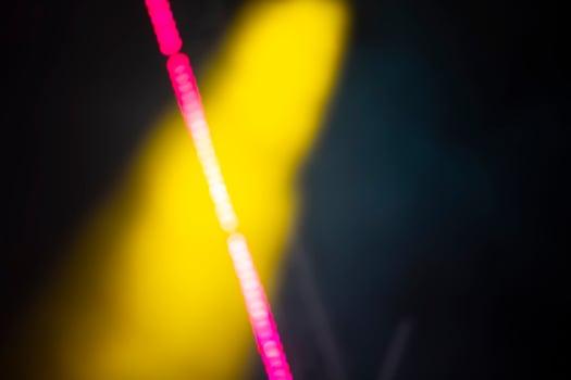 Yellow blurry smoke spot and pink bokeh streak. photo