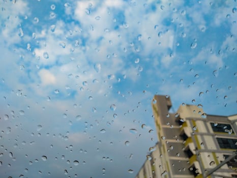 Glass rain drops, condo buildings, cloudy, blue sky, weather forecast, Meteorological Department photo