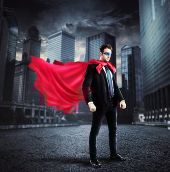 City superhero with red cape photo