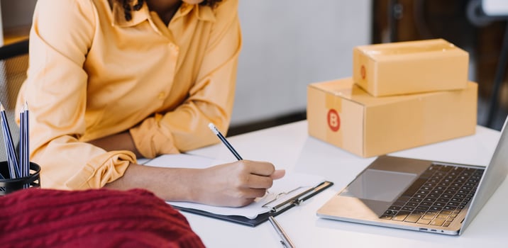 Diverse female fashion designers at work with tailor centimeters on necks and holds tablet and smartphone. independent creative design business. in studio photo