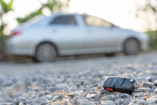 Lost car keys on the ground, Car keys dropped on the floor or fall lying on the street home front . Walking Away From Lost Car Key, can not transport, express, rush time, wast time, emergency photo