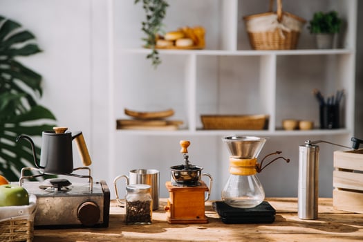Couple or asian people to smell coffee bean, make or brew coffee in kitchen home. Include cup, mug, bottle and kitchenware on table. Concept for morning lifestyle, love, happy, family, relationship. photo