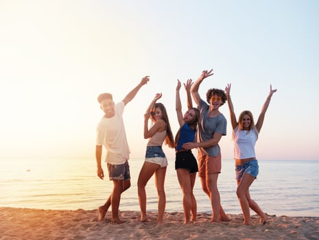 Group of friends having fun on the beach photo