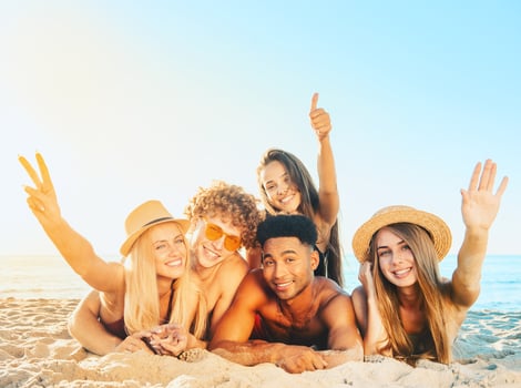Group of friends having fun on the beach photo