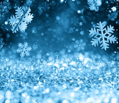 Abstract glowing Christmas blue background with snowflakes photo
