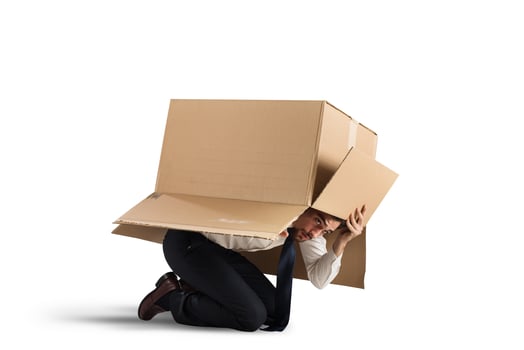 Afraid businessman on white background photo