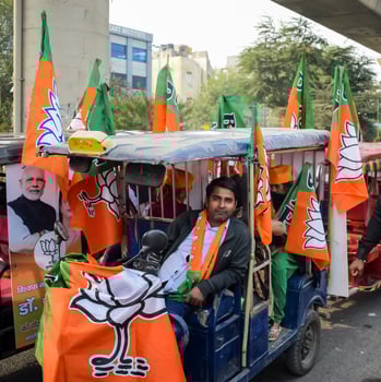 Delhi, India, December 02 2022 -Bharatiya Janata Party BJP supporter during mega road show in support of BJP candidate Pankaj Luthara to file nomination papers ahead of MCD local body Elections 2022 photo