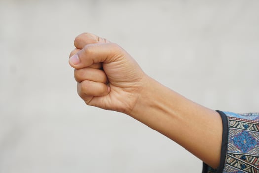 Human hand making a strong sign photo