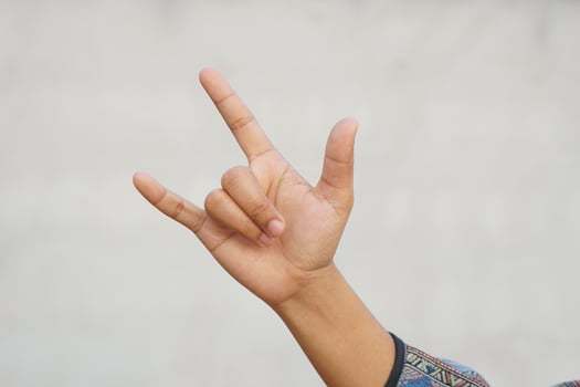 Human hand making a love sign photo