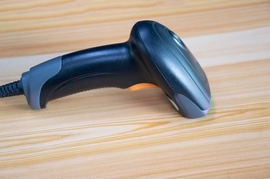 barcode scanner Placed on wooden floor photo