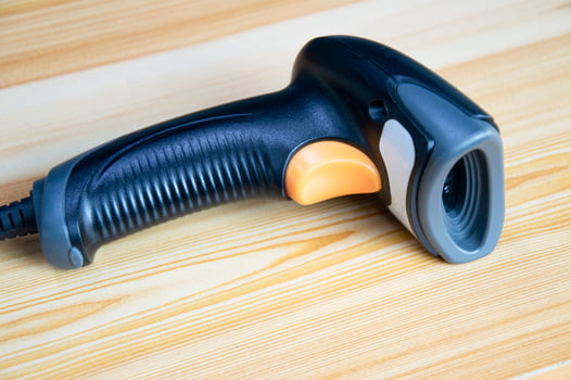 barcode scanner Placed on wooden floor photo