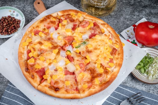 classic pizza with cheese on the table in a cafe on a wooden stand with a cut triangular piece and a pizza knife photo