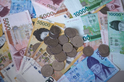 Korean won notes and Korean won coins for money concept background photo