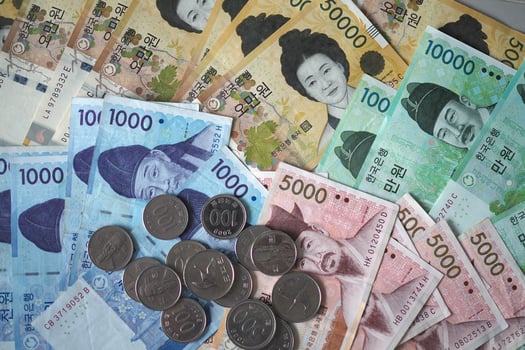 Korean won notes and Korean won coins for money concept background photo