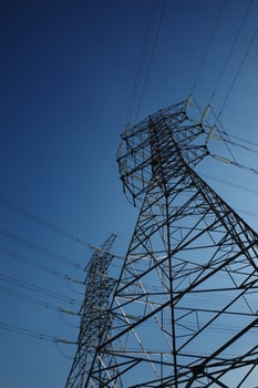 Towers and cables under blue sky photo