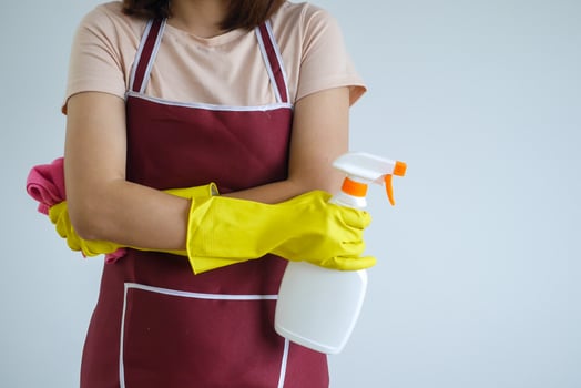 Close-up of a woman's body with cleaning equipment. photo