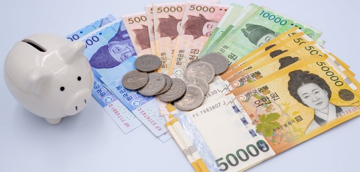 Korean won notes and Korean won coins for money concept background photo