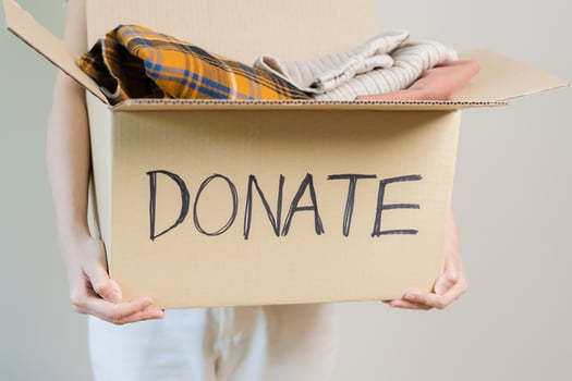 Recycling, Donation for poor, asian young woman pack, hand in holding donate box full with second hand clothes, charity helping and needy people. Reuse recycle, moving of object on white background. photo