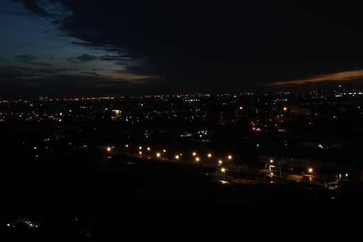 dark blue cloud with white light sunset sky background and city light midnight evening time photo