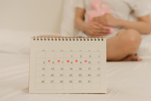 Menstruation, period cycle of monthly, hurt asian young woman, female hand in stomachache, suffer from premenstrual, belly or abdomen pain, using hot water bottle. Health problem Inflammation in body. photo