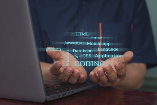 The hands holding coding and related text computer effect photo