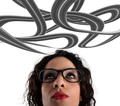 Confusion of way for a businesswoman. Concept of difficult career. Isolated on white background photo