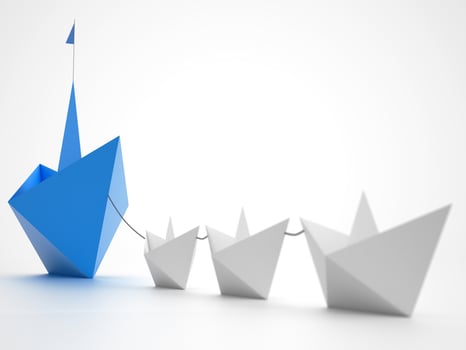 Unity is strength. Small paper boats that tow a bigger ship. Concept of teamwork and alliance. 3D Rendering photo