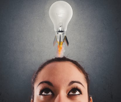 Fast lightbulb as a rocket ready to fly. Concept of new super idea photo