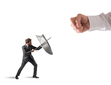 Little business man challenges big problems fighting with shield and sword photo