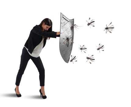 Woman defends herself from the attack of mosquitoes with a shield photo