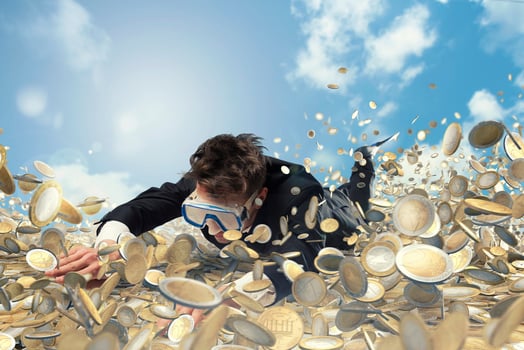 Businessman swims in a pool of money photo