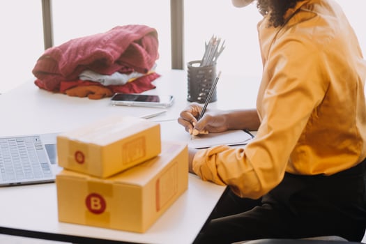 Small business entrepreneur SME freelance woman working at home office, BOX,tablet and laptop online, marketing, packaging, delivery, e-commerce concept in home office photo