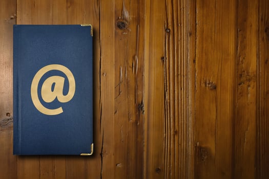Address book on a wooden desk photo