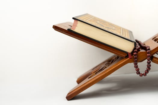 Holy Quran on table isolated for copy space photo