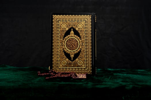 Stand Quran book isolated on black background photo