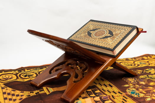 Quran in stand table with Arabic pedestal of worship photo