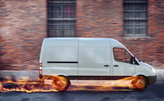 Super fast delivery of package service with van with wheels on fire. photo