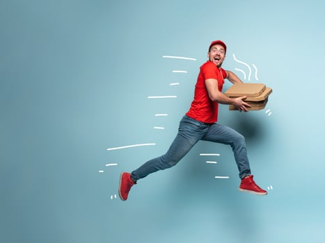 Courier runs fast to deliver quickly pizzas. Cyan background photo