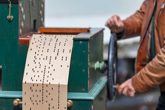 Man playing with a barrel organ photo