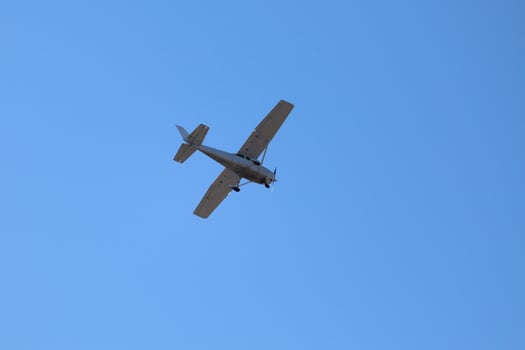 Propeller aircraft in mid-air photo