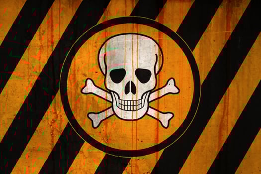 Poison symbol on a striped painted concrete wall photo