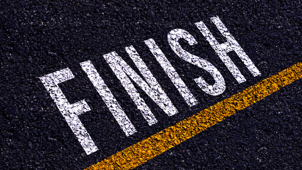 Finish text written and yellow line on the road in middle of the asphalt road, for business planning strategies and challenges, road to success concept, Finish word on street photo