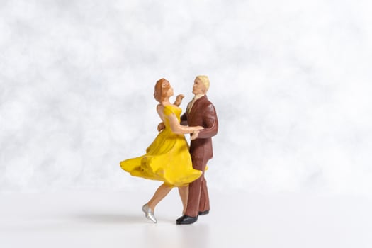 Miniature Couple dancing on dance floor , International dance day concept photo