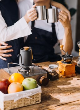 Image of newlywed couple cooking at home. Asia young couple cooking together with Bread and fruit in cozy kitchen in home photo