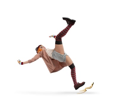 Funny clown slips on a banana peel. concept of unlucky photo