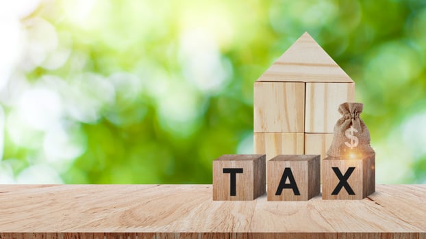 Houses and bag of taxes. Real estate tax. Taxation on purchase or sale of home, Maintenance of housing and land, Tax interest, Fees and duties, Rental business, Return on investment, Taxes relief photo