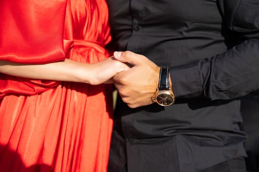 close-up of a loving couple holding hands, a symbol of love. photo