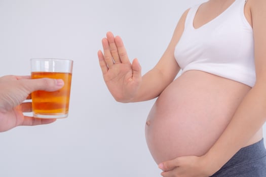 Pregnant woman rejecting and say no alcohol or liqueur during pregnancy, stop gesture, refuses , confuse, prevent disabilities or disorders in baby, healthy of life and caring about health of baby photo