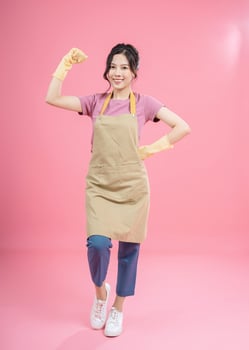 Young Asian woman housewife on background photo