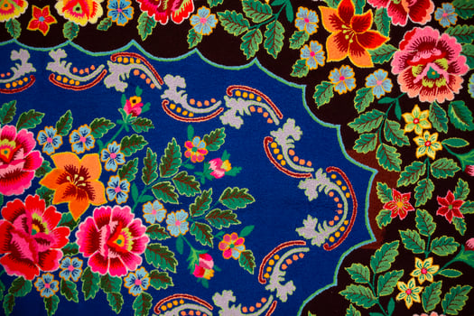 Traditional Slavic ancient embroidered bedspread. Ethnic Ukrainian or Belarusian pattern on the fabric. photo
